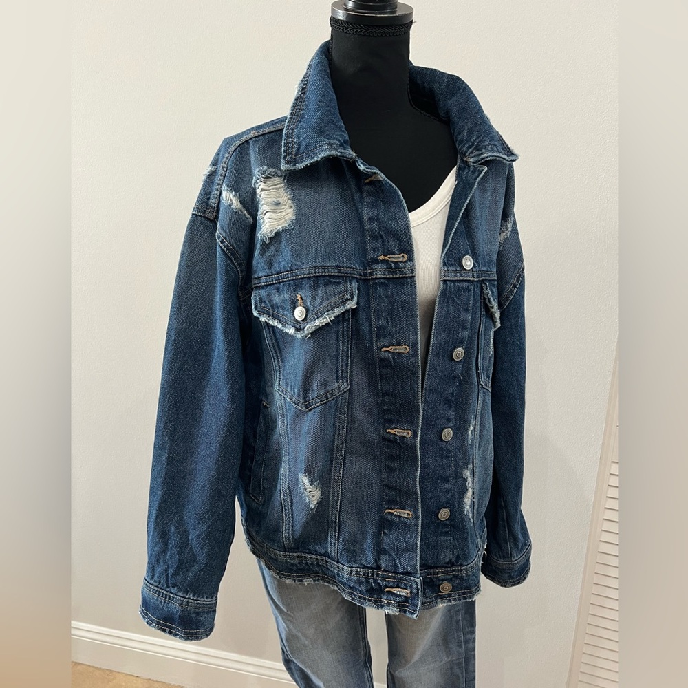 woman’s large medium wash distressed Jean jacket